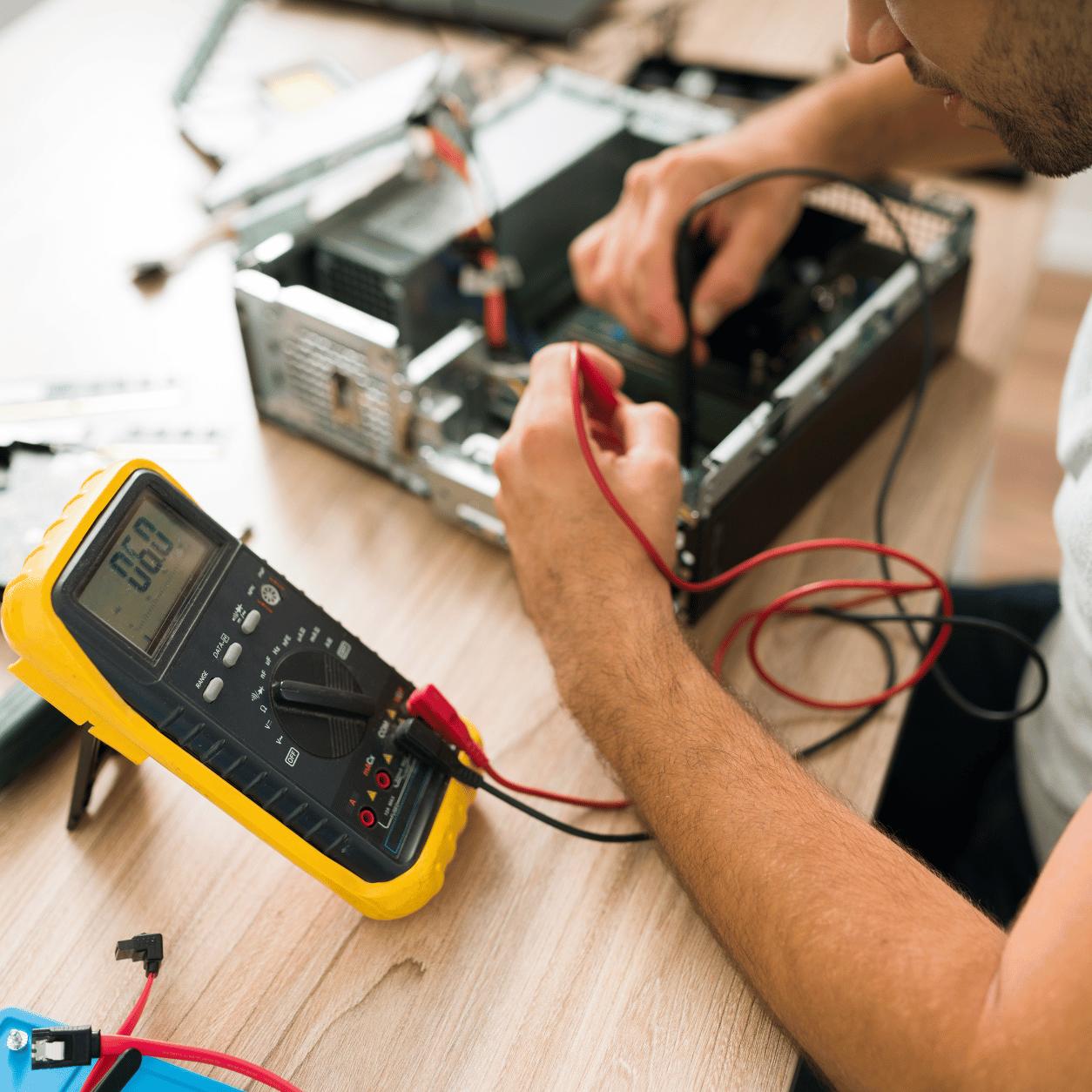 Engineer carrying out PAT testing on a portable electrical appliance
