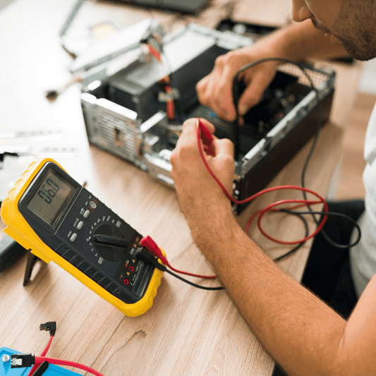 Engineer carrying out PAT testing on a portable electrical appliance